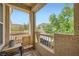 Private balcony with cozy seating and a view of the surrounding landscape at 10550 W Alexander Rd # 2179, Las Vegas, NV 89129