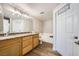 Bright bathroom with granite countertops, double sinks, and separate tub at 10550 W Alexander Rd # 2179, Las Vegas, NV 89129