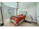 Cozy bedroom featuring a large bed, accent chair, and decorative chandelier at 10550 W Alexander Rd # 2179, Las Vegas, NV 89129