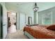 Charming bedroom featuring updated light fixture, double doors, and neutral walls at 10550 W Alexander Rd # 2179, Las Vegas, NV 89129