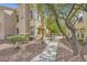 Beautiful landscaped grounds of a Mediterranean-style apartment complex at 10550 W Alexander Rd # 2179, Las Vegas, NV 89129