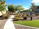 Well maintained community dog park with attractive landscaping and convenient waste disposal station at 10550 W Alexander Rd # 2179, Las Vegas, NV 89129