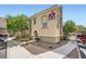 Exterior view of apartments with manicured landscaping and covered parking at 10550 W Alexander Rd # 2179, Las Vegas, NV 89129