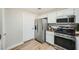 The kitchen features stainless steel appliances and ample cabinet space at 10550 W Alexander Rd # 2179, Las Vegas, NV 89129