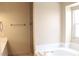 Bright bathroom featuring a soaking tub, towel rack and a window providing natural light at 128 Golf Course St, Las Vegas, NV 89145