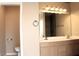 Double sink bathroom with new lighting and a full vanity at 128 Golf Course St, Las Vegas, NV 89145