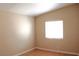 Cozy bedroom featuring warm paint and a window providing natural light at 128 Golf Course St, Las Vegas, NV 89145
