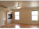 Spacious bedroom with fireplace, ceiling fan, and two windows for ample light at 128 Golf Course St, Las Vegas, NV 89145