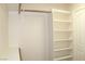 A closet with multiple shelves for maximum storage capacity and organization at 128 Golf Course St, Las Vegas, NV 89145