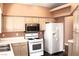 Well-lit kitchen with modern appliances, white cabinets, and plenty of counter space at 128 Golf Course St, Las Vegas, NV 89145