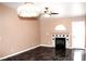 Inviting living room featuring a fireplace, tile floors, and ceiling fan at 128 Golf Course St, Las Vegas, NV 89145