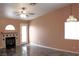Cozy living room with tile floors, a fireplace, and a door leading to the outdoors at 128 Golf Course St, Las Vegas, NV 89145