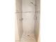 Modern tile shower with mosaic accents, a showerhead, and built in shelf at 128 Golf Course St, Las Vegas, NV 89145