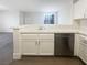 Modern kitchen featuring white cabinets, tile countertops, stainless steel appliances, and hardwood floors at 1405 S Nellis Blvd # 2087, Las Vegas, NV 89104