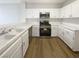 Bright kitchen with white cabinets, modern appliances, and a functional layout at 1405 S Nellis Blvd # 2087, Las Vegas, NV 89104