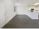 Welcoming living room featuring gray carpet and an open layout to the kitchen and front door at 1405 S Nellis Blvd # 2087, Las Vegas, NV 89104