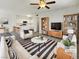 Bright open-concept living room featuring modern furnishings and seamless flow to the kitchen area at 1405 S Nellis Blvd # 2087, Las Vegas, NV 89104