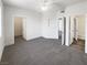 Expansive main bedroom featuring plush carpet, a ceiling fan, and access to ensuite bathroom at 1405 S Nellis Blvd # 2087, Las Vegas, NV 89104