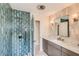 Modern bathroom showcasing a tiled shower, marble countertop, and stylish fixtures at 1712 Chapman Dr, Las Vegas, NV 89104