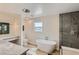 Bright bathroom featuring a modern tub, elegant vanity, and contemporary fixtures at 1712 Chapman Dr, Las Vegas, NV 89104