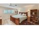 Cozy bedroom with hardwood floors, natural light, and a ceiling fan at 1712 Chapman Dr, Las Vegas, NV 89104