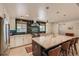 Bright eat-in kitchen with a large island, stainless steel appliances, and designer backsplash at 1712 Chapman Dr, Las Vegas, NV 89104