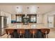 Spacious eat-in kitchen featuring an oversized marble island, stainless steel appliances, and tile backsplash at 1712 Chapman Dr, Las Vegas, NV 89104
