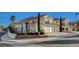 Lovely two-story home with a three-car garage, beautiful landscaping, and a tile roof at 1800 Summit Pointe Dr, Las Vegas, NV 89117