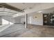 Spacious garage with a water heater, pegboard, and concrete flooring at 1800 Summit Pointe Dr, Las Vegas, NV 89117