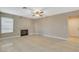 Living room featuring tile flooring, a fireplace, and neutral paint at 1800 Summit Pointe Dr, Las Vegas, NV 89117