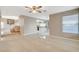 Open concept living room featuring tile floors, staircase, and view of the eat-in kitchen at 1800 Summit Pointe Dr, Las Vegas, NV 89117