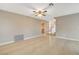 Open living room area with tile flooring, neutral paint, and a view of entry way at 1800 Summit Pointe Dr, Las Vegas, NV 89117