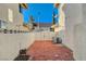 Sideyard patio featuring brick pavers, and block wall offering a private outdoor space at 1800 Summit Pointe Dr, Las Vegas, NV 89117
