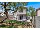 Beautiful backyard with patio area, lush lawn, mature shade tree, and storage shed at 1861 Windward Ct, Henderson, NV 89012