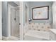 This bathroom features a glass-enclosed shower over a bathtub, offering both style and functionality at 1861 Windward Ct, Henderson, NV 89012