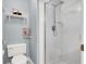 This bathroom features a glass-enclosed shower, toilet, and shelf, providing a refreshing, modern space at 1861 Windward Ct, Henderson, NV 89012