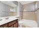 Bright bathroom featuring a bathtub, shower, vanity, and a large mirror with clean and modern finishes at 1861 Windward Ct, Henderson, NV 89012