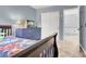 This cozy blue bedroom features a blue dresser and a closet with double sliding doors at 1861 Windward Ct, Henderson, NV 89012