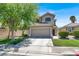 Charming two-story home featuring a two-car garage, landscaped yard, and a classic desert design at 1861 Windward Ct, Henderson, NV 89012