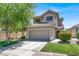 Charming two-story home featuring a two-car garage, landscaped yard, and a classic desert design at 1861 Windward Ct, Henderson, NV 89012