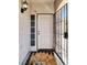 Inviting front entrance with security door, neutral tones, and a welcome mat at 1861 Windward Ct, Henderson, NV 89012