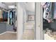 Hallway leading to bathroom features a walk-in closet perfect for storage and organization at 1861 Windward Ct, Henderson, NV 89012