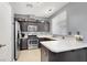 Modern kitchen features stainless steel appliances, a breakfast bar, and dark cabinetry at 1861 Windward Ct, Henderson, NV 89012