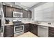 Well-equipped kitchen featuring stainless steel appliances and laminate countertops at 1861 Windward Ct, Henderson, NV 89012