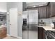 Bright and airy kitchen featuring stainless steel appliances, laminate countertop and pantry at 1861 Windward Ct, Henderson, NV 89012