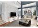 Stylish living room showcasing a modern TV console, open layout, and connecting rooms at 1861 Windward Ct, Henderson, NV 89012