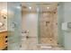 The modern bathroom offers a toilet behind a glass door and large tile shower with glass doors at 2000 Fashion Show Dr # 5509, Las Vegas, NV 89109