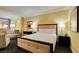 Inviting bedroom with a comfortable bed, well-lit desk, and cozy seating area, creating a warm and welcoming space at 2000 Fashion Show Dr # 5509, Las Vegas, NV 89109