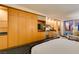 Modern bedroom with a kitchenette, built-in storage, and cozy seating, providing a comfortable and convenient living space at 2000 Fashion Show Dr # 5509, Las Vegas, NV 89109