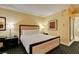 Clean bedroom with a tan bed frame and desk creates a peaceful place at 2000 Fashion Show Dr # 5509, Las Vegas, NV 89109